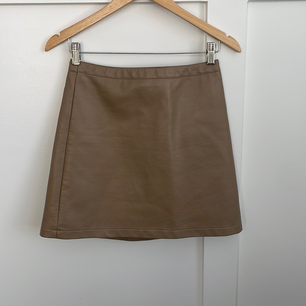 Faux leather mini skirt with zipper back closure. Sz small